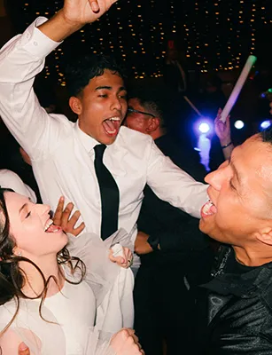 People Celebrating At A Party With Big Smiles